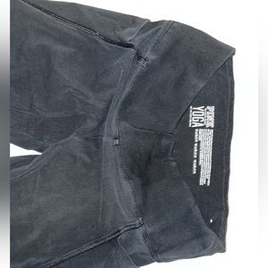 black yoga leggings with criss cross in back of leg